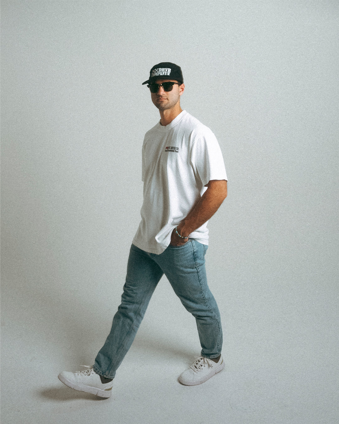 Man walking while wearing white heavyweight t shirt