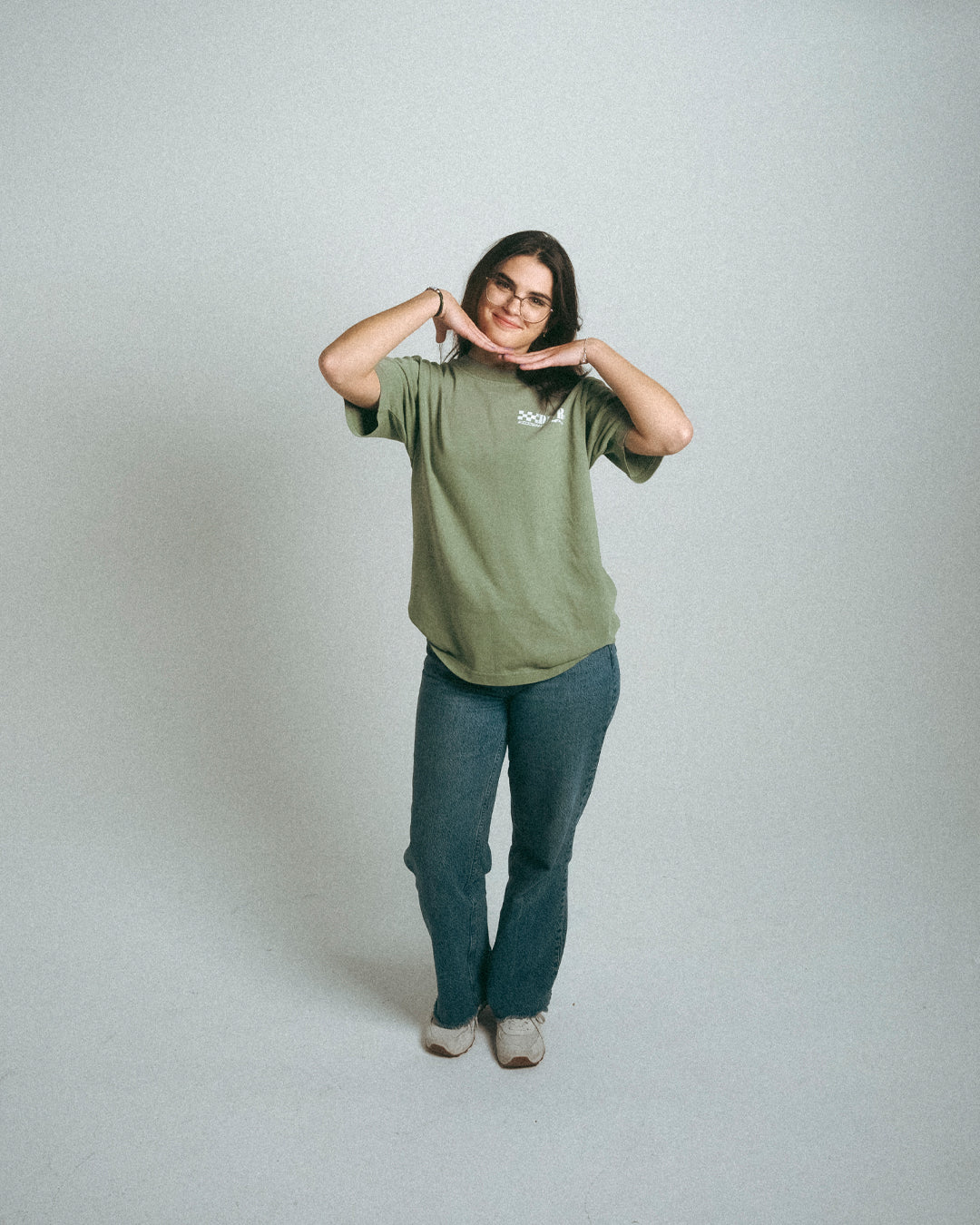 woman wearing green heavyweight oversized Porsche racing inspired shirt
