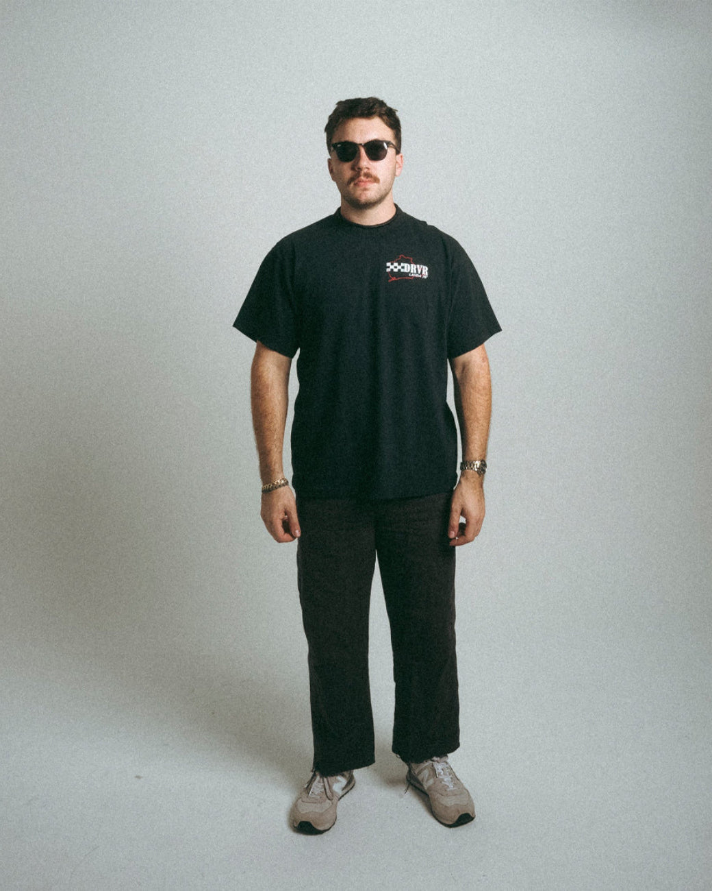 Man looking head on wearing black heavyweight Niki Lauda inspired shirt
