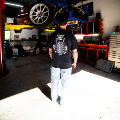Person in a garage working on a car