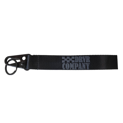 Black lanyard laid flat with grey lettering