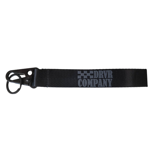 Black lanyard laid flat with grey lettering