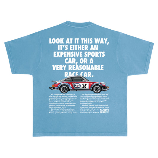 Blue t-shirt with a graphic of a race car and humorous text on a white background