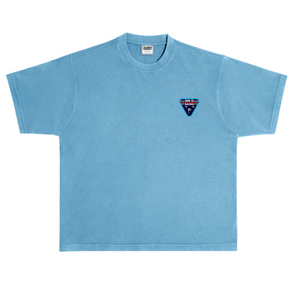 Light blue t-shirt with a small logo on the chest against a white background