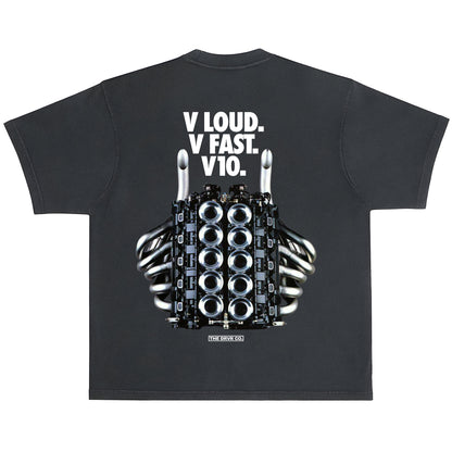 Black t-shirt with a graphic of a hand holding a car engine and text on the back, on a white background.
