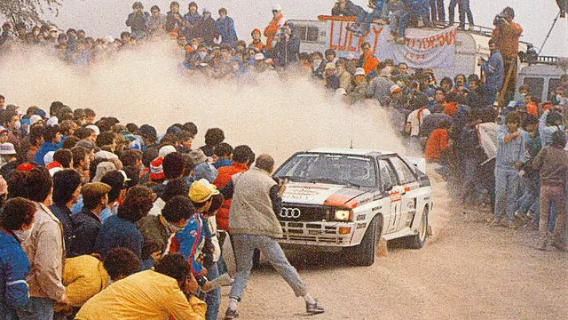 Audi Quattro drifting in rally race in front of many fans