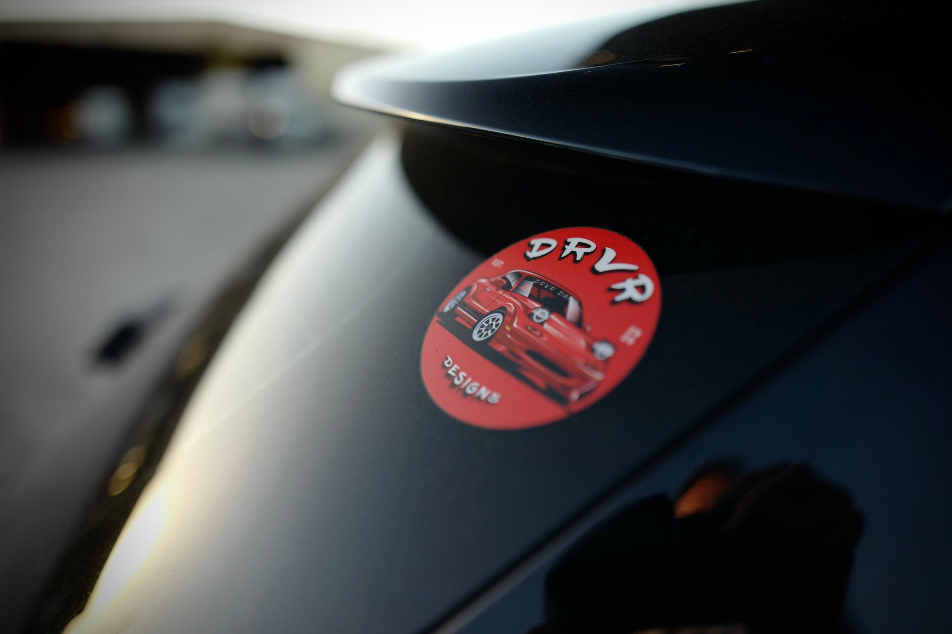 Red Miata sticker featuring thedrvrco logo